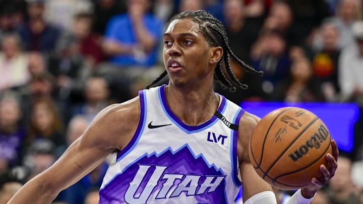 Mar 11, 2026; Salt Lake City, Utah, USA; Utah Jazz forward Cody Williams (5) makes a quick pass around New York Knicks guard Jalen Brunson (11) during the second half at Delta Center. Mandatory Credit: Peter Creveling-Imagn Images