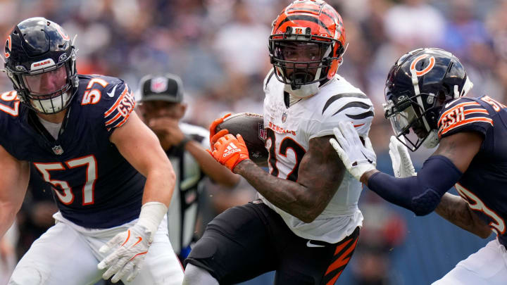 Trayveon Williams of the Bengals is tackled in the second quarter Saturday during a 27-3 Bears preseason win.