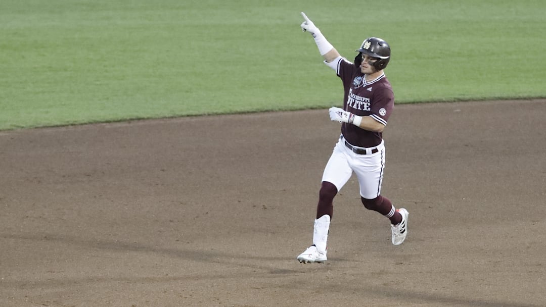 Jun 22, 2021; Omaha, Nebraska, USA;  Mississippi State Bulldogs right fielder Tanner Allen (5) gestures after hitting a three-run home run against the Virginia Cavaliers at TD Ameritrade Park. 