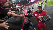 Arizona Cardinals safety Budda Baker (3) high-fives fans as he celebrates their 25-23 win over the