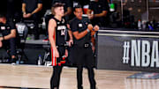 Oct 11, 2020; Lake Buena Vista, Florida, USA; Miami Heat guard Tyler Herro (14) talks with head coach Erik Spoelstra during the third quarter in game six of the 2020 NBA Finals against the Miami Heat at AdventHealth Arena. Mandatory Credit: Kim Klement-Imagn Images