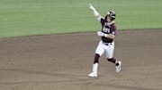 Jun 22, 2021; Omaha, Nebraska, USA;  Mississippi State Bulldogs right fielder Tanner Allen (5) gestures after hitting a three-run home run against the Virginia Cavaliers at TD Ameritrade Park. 