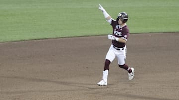 Jun 22, 2021; Omaha, Nebraska, USA;  Mississippi State Bulldogs right fielder Tanner Allen (5) gestures after hitting a three-run home run against the Virginia Cavaliers at TD Ameritrade Park. 