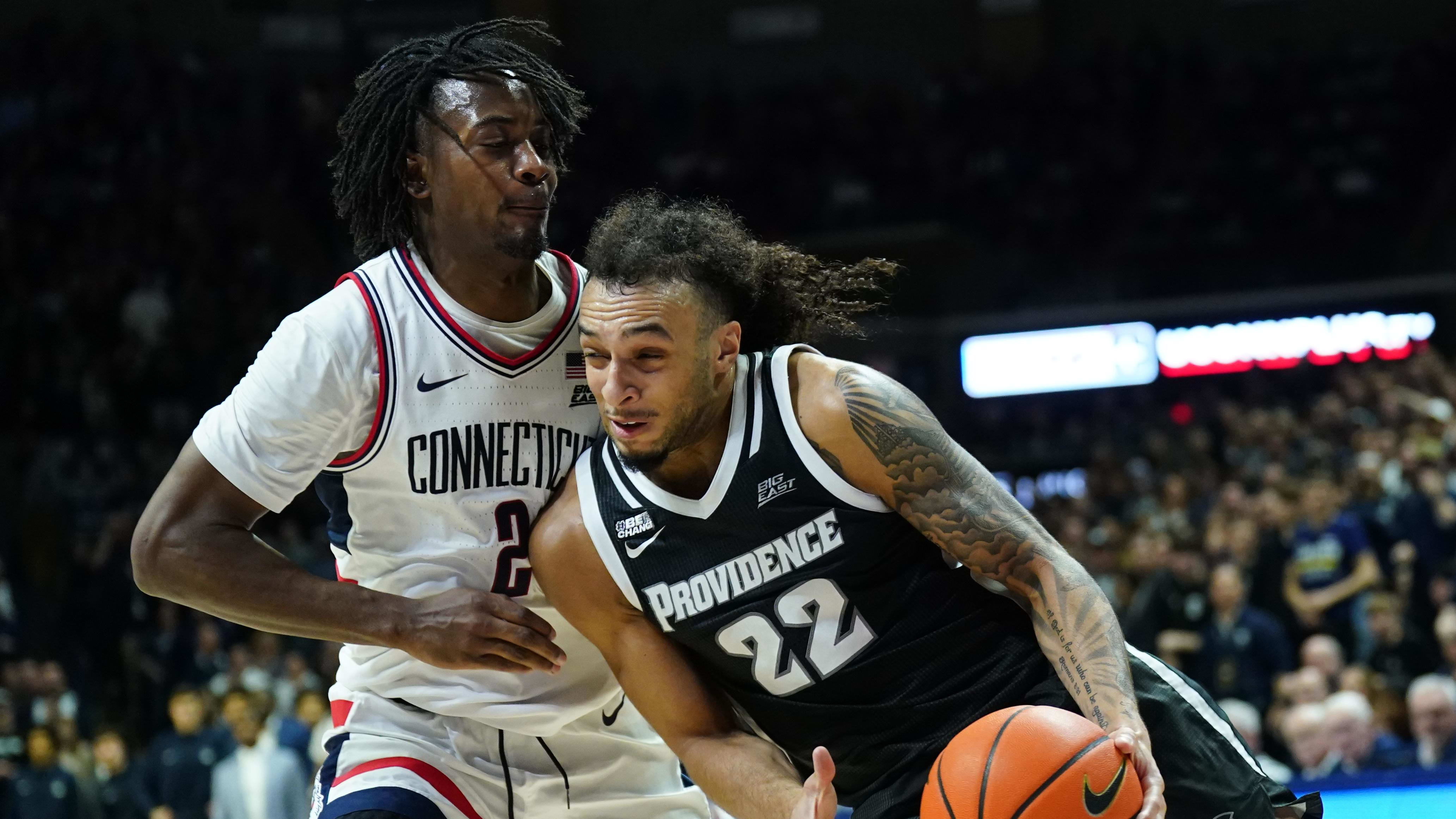 Providence guard Devin Carter drives to the rim against UConn