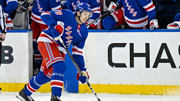 Apr 7, 2025; New York, New York, USA;  New York Rangers left wing Brennan Othmann (78) attempts a shot against the Tampa Bay Lightning during the second period at Madison Square Garden. Mandatory Credit: Dennis Schneidler-Imagn Images