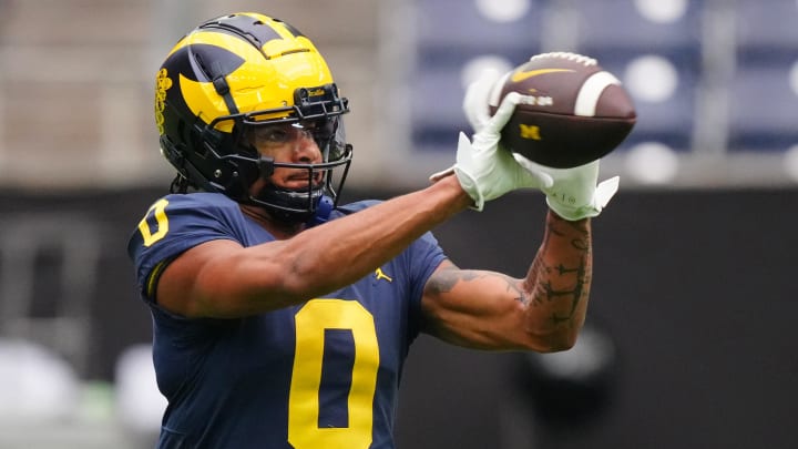 Jan 6, 2024; Houston, TX, USA; Michigan Wolverines wide receiver Darrius Clemons (0) catches the ball during a practice session before the College Football Playoff national championship game against the Washington Huskies at NRG Stadium. Mandatory Credit: Kirby Lee-USA TODAY Sports