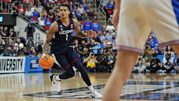 Mar 23, 2025; Raleigh, NC, USA; Connecticut Huskies guard Solo Ball (1) drives to the basket during the first half against the Florida Gators in the second round of the NCAA Tournament at Lenovo Center. Mandatory Credit: Bob Donnan-Imagn Images