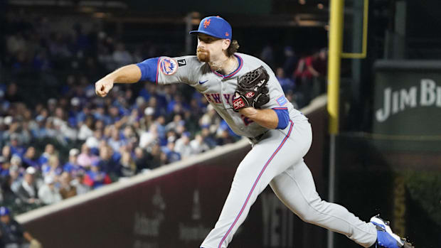 New York Mets pitcher Nolan McLean throwing the ball 