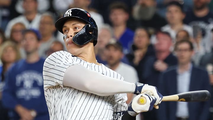 Oct 7, 2025; Bronx, New York, USA; New York Yankees outfielder Aaron Judge (99) hits a three-run home run in the fourth inning against the Toronto Blue Jays during game three of the ALDS round for the 2025 MLB playoffs at Yankee Stadium. Mandatory Credit: Vincent Carchietta-Imagn Images Oct 7, 2025; Bronx, New York, USA; New York Yankees outfielder Aaron Judge (99) hits a three-run home run in the fourth inning against the Toronto Blue Jays during game three of the ALDS round for the 2025 MLB playoffs at Yankee Stadium. Mandatory Credit: Vincent Carchietta-Imagn Images