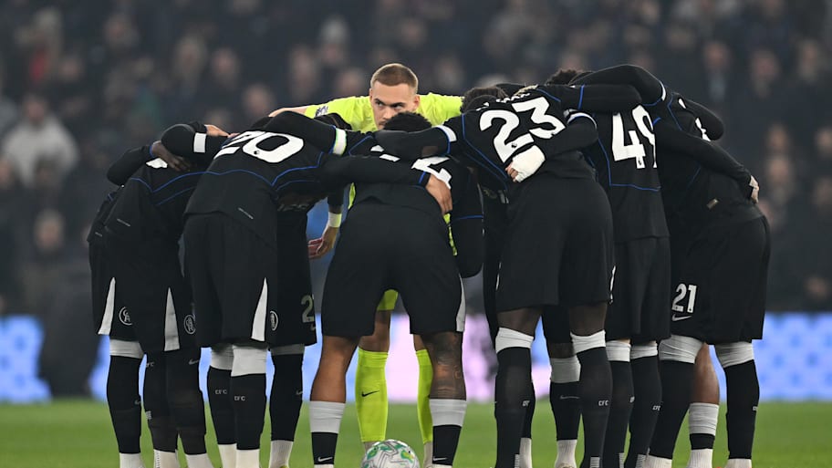 Chelsea players in a huddle.