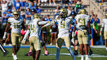 Oct 18, 2025; Durham, North Carolina, USA;  Georgia Tech Yellow Jackets defensive back Jy Gilmore (14) celebrates a play with defensive back Omar Daniels (9) during the second half of the game against Duke Blue Devils at Wallace Wade Stadium. Mandatory Credit: Jaylynn Nash-Imagn Images