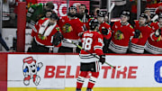 Dec 29, 2024; Chicago, Illinois, USA;  Chicago Blackhawks center Connor Bedard (98) celebrates his goal against the Dallas Stars during the first period at United Center. Mandatory Credit: Matt Marton-Imagn Images