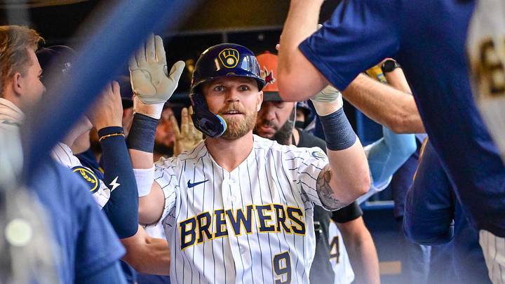 Aug 22, 2026; Milwaukee, Wisconsin, USA;  Milwaukee Brewers right fielder Jake Bauers (9) is greeted in the dugout after hitting a two run home run against the Atlanta Braves at American Family Field.  Mandatory Credit: Benny Sieu-Imagn Images