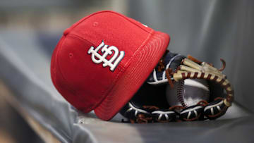 Sep 17, 2018; Atlanta, GA, USA; Detailed view of a St. Louis Cardinals hat and glove in the dugout against the Atlanta Braves in the first inning at SunTrust Park. Mandatory Credit: Brett Davis-Imagn Images