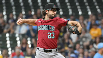 Sep 20, 2024; Milwaukee, Wisconsin, USA; Arizona Diamondbacks pitcher Zac Gallen (23) delivers a pitch against the Milwaukee Brewers in the first inning  at American Family Field. Mandatory Credit: Michael McLoone-Imagn Images