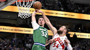 Oct 26, 2025; Dallas, Texas, USA; Dallas Mavericks forward Cooper Flagg (32) dunks the ball past Toronto Raptors forward Sandro Mamukelashvili (54) during the third quarter at the American Airlines Center. Mandatory Credit: Jerome Miron-Imagn Images