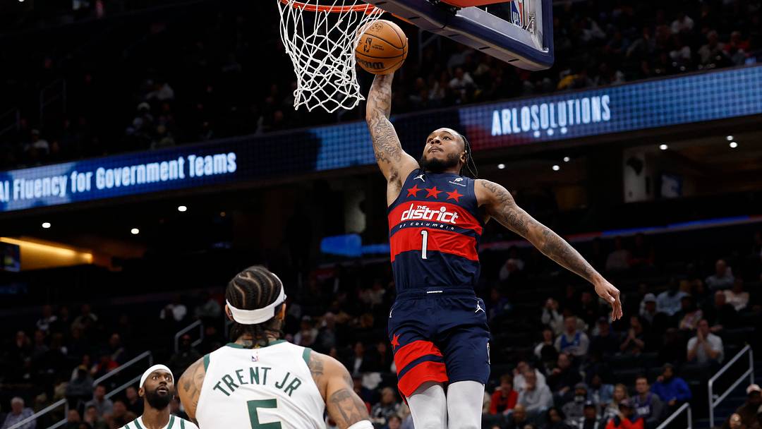 Dec 1, 2025; Washington, District of Columbia, USA; Washington Wizards forward Cam Whitmore (1) dunks the ball as Milwaukee Bucks guard Gary Trent Jr. (5) looks on in the second half at Capital One Arena. Mandatory Credit: Geoff Burke-Imagn Images Dec 1, 2025; Washington, District of Columbia, USA; Washington Wizards forward Cam Whitmore (1) dunks the ball as Milwaukee Bucks guard Gary Trent Jr. (5) looks on in the second half at Capital One Arena. Mandatory Credit: Geoff Burke-Imagn Images
