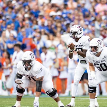 Sep 14, 2024; Gainesville, Florida, USA; Texas A&M Aggies quarterback Marcel Reed (10) prepares to hike the ball against the Florida Gators during the first half at Ben Hill Griffin Stadium. Mandatory Credit: Matt Pendleton-Imagn Images