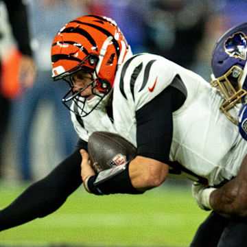 Baltimore Ravens defensive tackle Nnamdi Madubuike (92) tackles Cincinnati Bengals quarterback Joe Burrow (9) in the third quarter of the NFL game at M&T Banks Stadium in Baltimore on Thursday, Nov. 7, 2024.