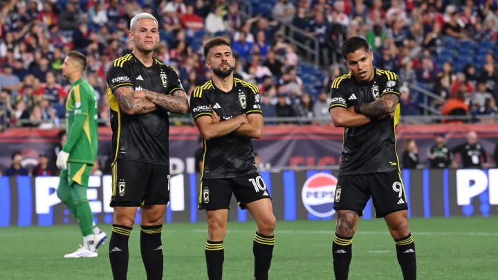 Jun 29, 2024; Foxborough, Massachusetts, USA; Columbus Crew forward Diego Rossi (10) celebrates with forward Christian Ramirez (17) and forward Cucho Hernandez (9) after scoring a goal against the New England Revolution during the first half at Gillette Stadium. Mandatory Credit: Eric Canha-USA TODAY Sports