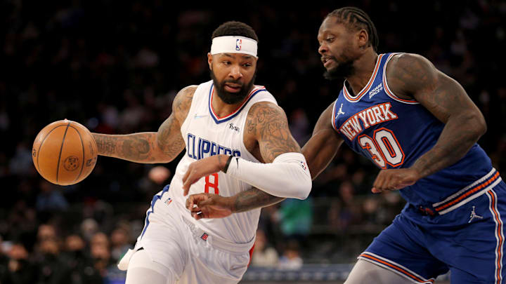 Jan 23, 2022; New York, New York, USA; Los Angeles Clippers forward Marcus Morris Sr. (8) drives around New York Knicks forward Julius Randle (30) during the third quarter at Madison Square Garden. Mandatory Credit: Brad Penner-Imagn Images