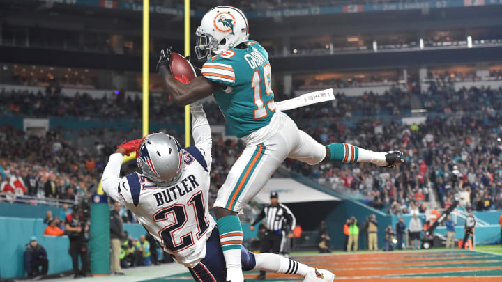 Wide receiver Jakeem Grant makes a catch over New England Patriots cornerback Malcolm Butler for a touchdown in a 2017 Monday night victory at Hard Rock Stadium.