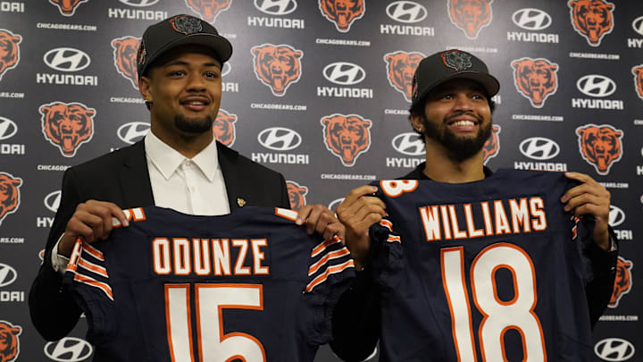 Chicago Bears first round draft choices Rome Odunze and Caleb Williams pose for photos at a press conference at Halas Hall. Chicago Bears first round draft choices Rome Odunze and Caleb Williams pose for photos at a press conference at Halas Hall.