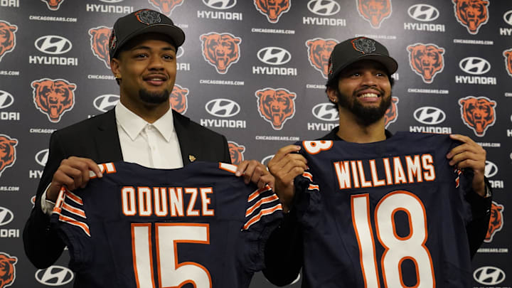 Apr 26, 2024; Lake Forest, IL, USA; Chicago Bears first round draft choices Rome Odunze (left) and Caleb Williams (right) pose for photos at a press conference at Halas Hall. Apr 26, 2024; Lake Forest, IL, USA; Chicago Bears first round draft choices Rome Odunze (left) and Caleb Williams (right) pose for photos at a press conference at Halas Hall.