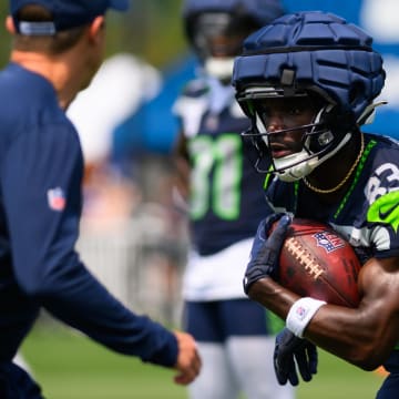 Jul 27, 2024; Renton, WA, USA; Seattle Seahawks wide receiver Dareke Young (83) carries the ball after making a catch during training camp at Virginia Mason Athletic Center. Mandatory Credit: Steven Bisig-USA TODAY Sports