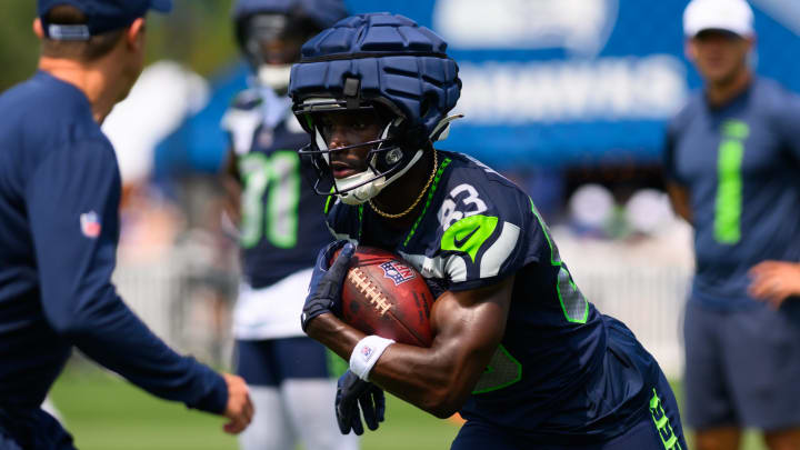 Jul 27, 2024; Renton, WA, USA; Seattle Seahawks wide receiver Dareke Young (83) carries the ball after making a catch during training camp at Virginia Mason Athletic Center. Mandatory Credit: Steven Bisig-USA TODAY Sports