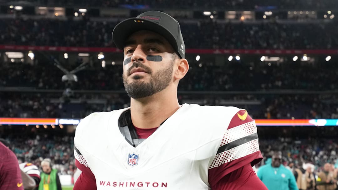 Nov 16, 2025; Madrid, Spain; Washington Commanders quarterback Marcus Mariota (8) walks off the field after the 2025 NFL Madrid Game against the Miami Dolphins at Santiago Bernabeu Stadium.  