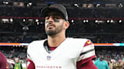 Nov 16, 2025; Madrid, Spain; Washington Commanders quarterback Marcus Mariota (8) walks off the field after the 2025 NFL Madrid Game against the Miami Dolphins at Santiago Bernabeu Stadium.  