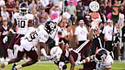 Oct 19, 2024; Starkville, Mississippi, USA; Mississippi State Bulldogs wide receiver Kevin Coleman Jr. (3) dives into the endzone against Texas A&M Aggies defensive back Dalton Brooks (25) during the fourth quarter at Davis Wade Stadium at Scott Field. Mandatory Credit: Matt Bush-Imagn Images