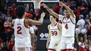Oct 17, 2024; Piscataway, NJ, USA;  Rutgers Scarlet Knights guard Airious Bailey (4) celebrates with guard Dylan Harper (2) during a timeout in the second half against the St. John's Red Storm at Jersey Mike's Arena. Mandatory Credit: Wendell Cruz-Imagn Images