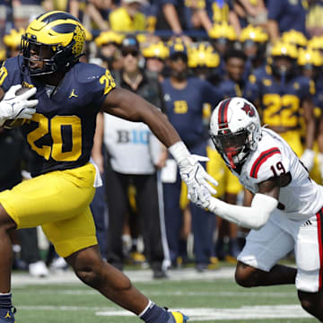 Sep 14, 2024; Ann Arbor, Michigan, USA;  Michigan Wolverines running back Kalel Mullings (20) runs the ball against the Arkansas State Red Wolves during the first half at Michigan Stadium. Mandatory Credit: Rick Osentoski-Imagn Images