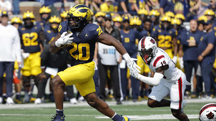 Sep 14, 2024; Ann Arbor, Michigan, USA;  Michigan Wolverines running back Kalel Mullings (20) runs the ball against the Arkansas State Red Wolves during the first half at Michigan Stadium. Mandatory Credit: Rick Osentoski-Imagn Images