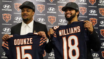 Apr 26, 2024; Lake Forest, IL, USA; Chicago Bears first round draft choices Rome Odunze (left) and