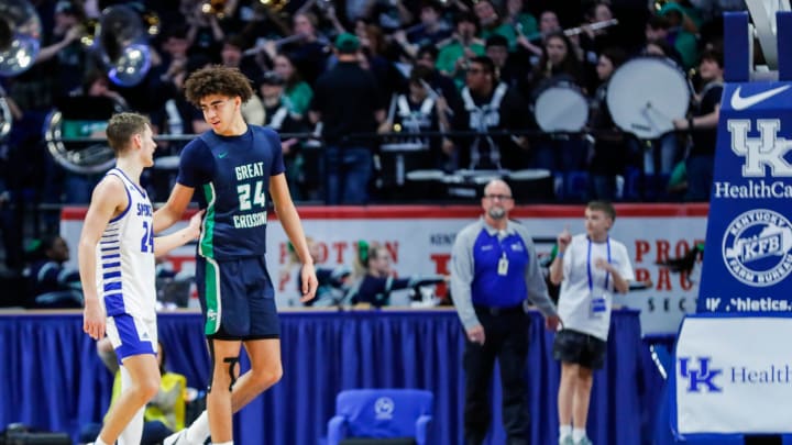 Spencer County's Camden Cox (24) and Great Crossing's Malachi Moreno (24) come together after the No.1 Warhawks rallied to beat the much smaller but tough Spencer team in the first round of the 2024 UK Healthcare KHSAA Boys' Sweet 16 in Lexington. March 20, 2024