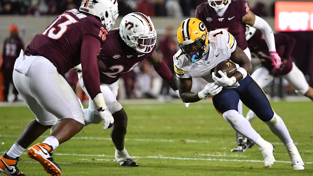 Cal running back Kendrick Raphael tries to gain yardage vs. Virginia Tech