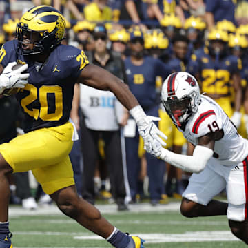 Sep 14, 2024; Ann Arbor, Michigan, USA;  Michigan Wolverines running back Kalel Mullings (20) runs the ball against the Arkansas State Red Wolves during the first half at Michigan Stadium.