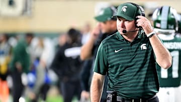 Sep 28, 2024; East Lansing, Michigan, USA; Michigan State Spartans head coach Jonathan Smith watches from the sidelines during the fourth quarter as the Ohio State Buckeyes defeat his team at Spartan Stadium. Mandatory Credit: Dale Young-Imagn Images