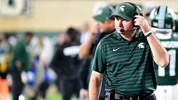 Sep 28, 2024; East Lansing, Michigan, USA; Michigan State Spartans head coach Jonathan Smith watches from the sidelines during the fourth quarter as the Ohio State Buckeyes defeat his team at Spartan Stadium. Mandatory Credit: Dale Young-Imagn Images