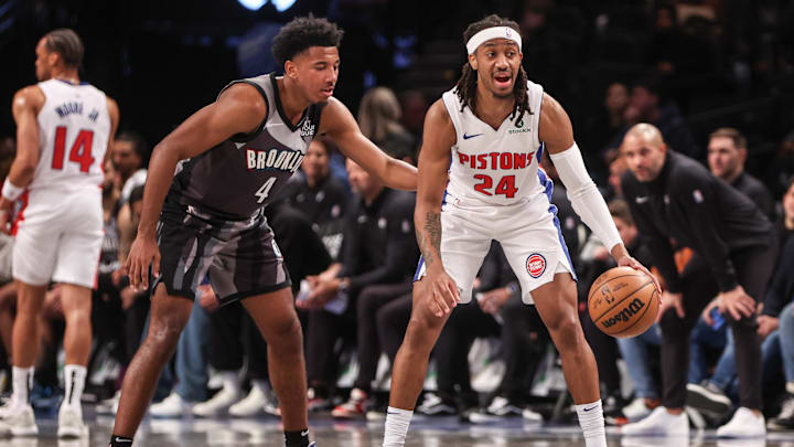 Jan 8, 2025; Brooklyn, New York, USA;  Detroit Pistons guard Daniss Jenkins (24) is guarded by Brooklyn Nets guard Reece Beekman (4) in the fourth quarter at Barclays Center. Mandatory Credit: Wendell Cruz-Imagn Images