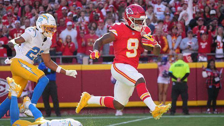 Oct 18, 2026; Kansas City, Missouri, USA;  Kansas City Chiefs running back Kenneth Walker III (9) rushes and breaks a tackle from Los Angeles Chargers cornerback Tarheeb Still (4) during the first quarter at GEHA Field at Arrowhead Stadium.  Mandatory Credit: Denny Medley-Imagn Images
