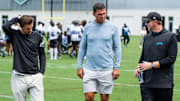 Jacksonville Jaguars general manager James Gladstone, left, Jacksonville Jaguars is executive vice president of football operations Tony Boselli, center and Jacksonville Jaguars head coach Liam Coen, right, all talk on the field after the Jacksonville Jaguars’ mandatory minicamp Tuesday June 10, 2025 at the Miller Electric Center in Jacksonville, Fla. [Doug Engle/Florida Times-Union]