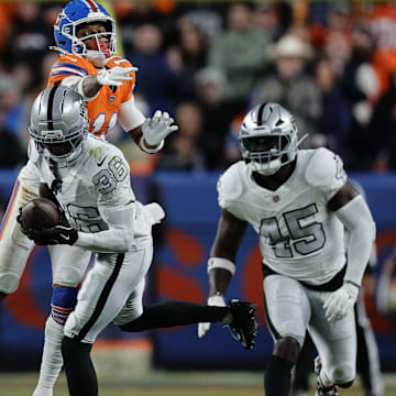 Nov 6, 2025; Denver, Colorado, USA; Las Vegas Raiders cornerback Kyu Blu Kelly (36) makes an interception against the Denver Broncos during the second half at Empower Field at Mile High. Mandatory Credit: Isaiah J. Downing-Imagn Images