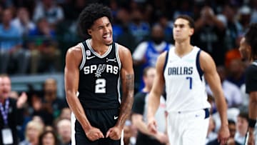 Oct 22, 2025; Dallas, Texas, USA;   San Antonio Spurs guard Dylan Harper (2) reacts during the first half against the Dallas Mavericks at American Airlines Center. Mandatory Credit: Kevin Jairaj-Imagn Images