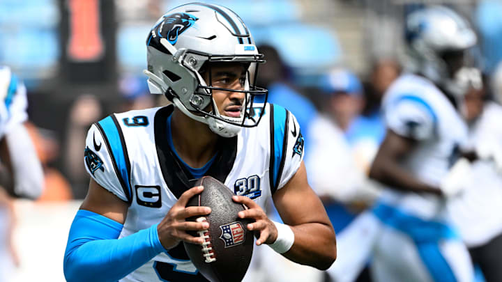 Carolina Panthers quarterback Bryce Young looks to throw a pass.