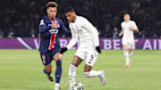 Desiré Doué (left) and Marcus Rashford fight for the ball during the first leg of Aston Villa vs. Paris Saint-Germain.