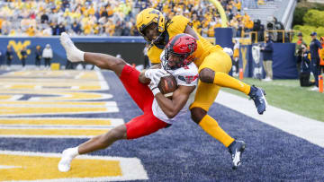 Sep 23, 2023; Morgantown, West Virginia, USA; Texas Tech Red Raiders wide receiver Jerand Bradley (9) catches a pass for a touchdown against West Virginia Mountaineers cornerback Malachi Ruffin (14) during the fourth quarter at Mountaineer Field at Milan Puskar Stadium. Mandatory Credit: Ben Queen-USA TODAY Sports